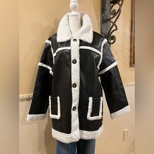 Faux leather long black jacket trimmed w/white faux fur. Front buttons. L. NWOT